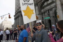 New York,  12,000 N.Y.C.  Municipal employees (police,fire,sanitation,teachers) protest  the  
Mandate to get vaccinated by October 29, 2021 or be put on unpaid leave. The protesters walked across the Brooklyn Bridge to City Hall.