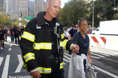 New York,  12,000 N.Y.C.  Municipal employees (police,fire,sanitation,teachers) protest  the  
Mandate to get vaccinated by October 29, 2021 or be put on unpaid leave. The protesters walked across the Brooklyn Bridge to City Hall.