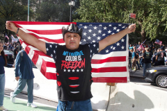 New York,  12,000 N.Y.C.  Municipal employees (police,fire,sanitation,teachers) protest  the  
Mandate to get vaccinated by October 29, 2021 or be put on unpaid leave. The protesters walked across the Brooklyn Bridge to City Hall.
