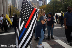 New York,  12,000 N.Y.C.  Municipal employees (police,fire,sanitation,teachers) protest  the  
Mandate to get vaccinated by October 29, 2021 or be put on unpaid leave. The protesters walked across the Brooklyn Bridge to City Hall.