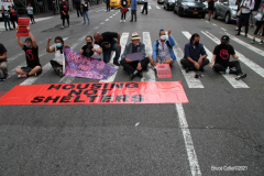New York,   Housing Works inc. Advocacy group holds a rally and civil disobedience by laying down and blocking Broadway in front of City Hall. New York City Police Department officers arrested 9 people.