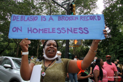 New York,   Housing Works inc. Advocacy group holds a rally and civil disobedience by laying down and blocking Broadway in front of City Hall. New York City Police Department officers arrested 9 people.