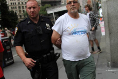 New York,   Housing Works inc. Advocacy group holds a rally and civil disobedience by laying down and blocking Broadway in front of City Hall. New York City Police Department officers arrested 9 people.