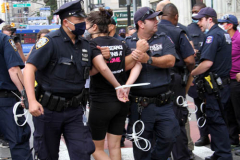 New York,   Housing Works inc. Advocacy group holds a rally and civil disobedience by laying down and blocking Broadway in front of City Hall. New York City Police Department officers arrested 9 people.