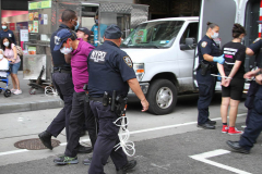 New York,   Housing Works inc. Advocacy group holds a rally and civil disobedience by laying down and blocking Broadway in front of City Hall. New York City Police Department officers arrested 9 people.