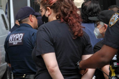 New York,   Housing Works inc. Advocacy group holds a rally and civil disobedience by laying down and blocking Broadway in front of City Hall. New York City Police Department officers arrested 9 people.