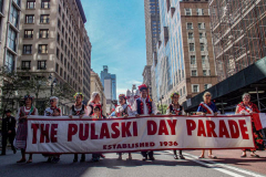Polish-Americans gathered by the thousands in Midtown Manhattan, to celebrate the 84th Pulaski Day Parade, commemorating and honoring General Casimir Pulaski a Polish born aristocrat who is revered and remembered as both a Polish and an American Revolutionary War Hero, fighting for freedom in his homeland and adopted nation.
Polish government and prominent local community figures came to celebrate the abundance of festivities and events that took place, marching up 5th ave from 36th to 53rd St. 
This year, the theme spotlighted the 100th Birthday Anniversary of Pope John Paul II who was born in Wadowice, Poland. 
(C) Bianca Otero, NYC, NY. October 3, 2021.