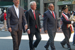 NYPD Commissioner Dermot Shea (l) leads the Pulaski Day Parade along dignitaries. At right is Sgt. Donna M. Zabo, president of the NYPD Pulaski Association which represents Polish-American officers.
