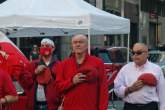 Republican mayoral candidate and Guardian Angels founder Curtis Sliwa doffs his trademark red beret for the playing of the National Anthem at the start of the Pulaski Day Parade.