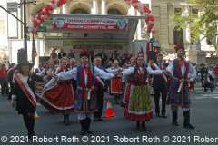 Dancers perform a traditional polonaise in front of the reviewing stand outside the New York Public Library.