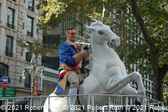 A participant acts out the role of General Casimir Pulaski while riding a float.