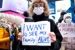 February 24, 2022 - New York, NY, United States: Woman with a sign with the words "I want to see my family alive" at a "Stop Putin" rally organized as a response to the war in Ukraine.