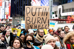 February 24, 2022 - New York, NY, United States: Demonstrator with a sign with the words "Putin burn in hell!" at a "Stop Putin" rally organized as a response to the war in Ukraine.