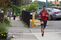 Photographs by Mary DiBiase Blaich
Sunday, July 04, 2021
Forest Avenue
West Brighton, Staten Island
Happy Fourth of July!
For over 35 years, the Blaich Family has spent the early morning hours on the Fourth handing out water to runners in the annual Pepper Martin 5 Mile Race later renamed for Arielle Newman. Last year the race was cancelled, but a small group of local runners staged their own competition. This year they did the same. No permits were issued,which meant the traffic was not stopped, so the runners made their way on Forest Avenue either on the sidewalk or the street, dodging cars. The official sponsor was the Correcaminos group of runners.