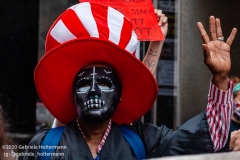A man wears a death mask while a coalition of activists, educators, parents, and students protest to stop the in-person reopening of  New York City public schools amidst the COOVID-19 pandemic in New York City on August 3, 2020. (Photo by Gabriele Holtermann/Sipa USA)