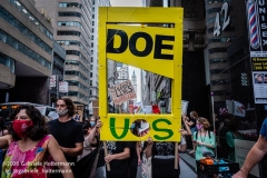 Protesters carry a makeshift guillotine representing the Department of Education, while a coalition of activists, educators, parents, and students protest to stop the in-person reopening of  New York City public schools amidst the COOVID-19 pandemic in New York City on August 3, 2020. (Photo by Gabriele Holtermann/Sipa USA)