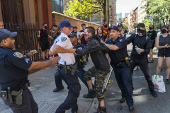 NEW YORK, NY - AUGUST 6: New York Police Department officers arrest a pro-abortion protester outside of a Catholic church in downtown Manhattan on August 6, 2022 in New York City. The protests occurred  at the Basilica of St. Patricks Old Cathedral are where a small number of anti-abortion activists worship. Five pro-abortion rights protesters were arrested today by the New York Police Department. (Photo by Robert Nickelsberg/Getty Images)