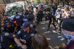 NEW YORK, NY - AUGUST 6: Pro-abortion protesters confront New York Police Department officers  while arrests are being made, left, outside of a Catholic church in downtown Manhattan on August 6, 2022 in New York City. The protests occurred  at the Basilica of St. Patricks Old Cathedral are where a small number of anti-abortion activists worship. Five pro-abortion rights protesters were arrested today by the New York Police Department. (Photo by Robert Nickelsberg/Getty Images)
