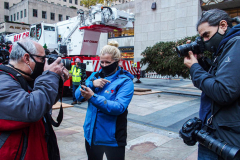Photographers taking a picture of a picture of a picture of each other while waiting for the posting of the Rockefeller Christmas Tree.
The Rockefeller Christmas Tree arrived at Rockefeller Plaza, Manhattan, NYC on the morning of November 13, 2021. 
Spectators flocked to watch the spectacle as well as those involved in the assembly and press after last year’s event was restricted due to COVID.
People came together and enjoyed the impressive 12 ton and 85 year old Norway Spruce tree, coming from a donation via a family  Elkton, Maryland. This is the first Maryland tree that has ever been chosen in this tradition as the Rockefeller Center Tree.
 (C) Bianca Otero. NYC. November 13, 2021.