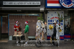 Santa Con participants take a break during Santa Con in New York, NY, on Dec. 11, 2021. (Photo by Gabriele Holtermann/Sipa USA)