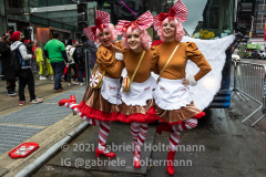 Three "Candy Cane" pose for a photo outside Margaritaville Restaurant in Times Square in New York, NY, on Dec. 11, 2021. (Photo by Gabriele Holtermann/Sipa USA)