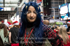 An "Elf" stands outside Margaritaville Restaurant in Times Square in New York, NY, on Dec. 11, 2021. (Photo by Gabriele Holtermann/Sipa USA)