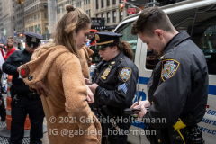 NYPD officers issue summonses for the consumption of drinking alcohol in public to Santa Con participants in New York, NY, on Dec. 11, 2021. (Photo by Gabriele Holtermann/Sipa USA)