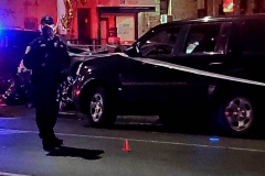 New York-  person shot on the conner of East 19th Street and Avenue M. in the Midwood section of Brooklyn. Police from the 70th precinct investigate the shooting. Red markers indicate where shell casing lay on the ground.
