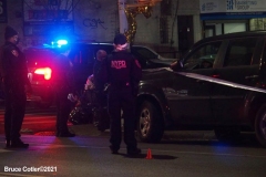 New York-  person shot on the conner of East 19th Street and Avenue M. in the Midwood section of Brooklyn. Police from the 70th precinct investigate the shooting. Red markers indicate where shell casing lay on the ground.