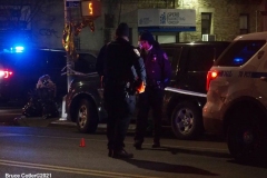 New York-  person shot on the conner of East 19th Street and Avenue M. in the Midwood section of Brooklyn. Police from the 70th precinct investigate the shooting. Red markers indicate where shell casing lay on the ground.