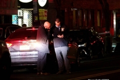 New York-  person shot on the conner of East 19th Street and Avenue M. in the Midwood section of Brooklyn. Police from the 70th precinct investigate the shooting. Red markers indicate where shell casing lay on the ground.
