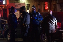 New York-  person shot on the conner of East 19th Street and Avenue M. in the Midwood section of Brooklyn. Police from the 70th precinct investigate the shooting. Red markers indicate where shell casing lay on the ground.