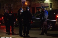 New York-  person shot on the conner of East 19th Street and Avenue M. in the Midwood section of Brooklyn. Police from the 70th precinct investigate the shooting. Red markers indicate where shell casing lay on the ground.