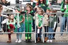 Staten Island St Patrick’s Day Parade
Sunday, March 06, 2022
Foret Avenue
West Brighton, Staten Island, NY
For Credit:  Mary DiBiase Blaich

The annual St Patrick’s Day Parade returned to Staten Island after a covid absence last year.  Controversy surrounded the event with the decision by the parade organizers to not allow LGBTQ groups to march.  The banned groups held a press conference prior to the parade.  In conduction with the parade, there is always a one mile race that precedes the parade.  It went on, but many racers ran in a second race in support of the banned groups.  
The weather was warm, but mixed with clouds, rain and sun.  Only two elected officials participated… Boro President Vito Fossella in a bright green sweater, and Congresswoman Nicole Malliotakis in a green Ireland sweater.