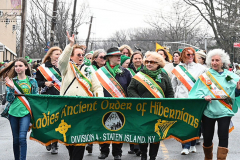 Staten Island St Patrick’s Day Parade
Sunday, March 06, 2022
Foret Avenue
West Brighton, Staten Island, NY
For Credit:  Mary DiBiase Blaich

The annual St Patrick’s Day Parade returned to Staten Island after a covid absence last year.  Controversy surrounded the event with the decision by the parade organizers to not allow LGBTQ groups to march.  The banned groups held a press conference prior to the parade.  In conduction with the parade, there is always a one mile race that precedes the parade.  It went on, but many racers ran in a second race in support of the banned groups.  
The weather was warm, but mixed with clouds, rain and sun.  Only two elected officials participated… Boro President Vito Fossella in a bright green sweater, and Congresswoman Nicole Malliotakis in a green Ireland sweater.