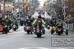 Staten Island St Patrick’s Day Parade
Sunday, March 06, 2022
Foret Avenue
West Brighton, Staten Island, NY
For Credit:  Mary DiBiase Blaich

The annual St Patrick’s Day Parade returned to Staten Island after a covid absence last year.  Controversy surrounded the event with the decision by the parade organizers to not allow LGBTQ groups to march.  The banned groups held a press conference prior to the parade.  In conduction with the parade, there is always a one mile race that precedes the parade.  It went on, but many racers ran in a second race in support of the banned groups.  
The weather was warm, but mixed with clouds, rain and sun.  Only two elected officials participated… Boro President Vito Fossella in a bright green sweater, and Congresswoman Nicole Malliotakis in a green Ireland sweater.