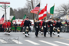 Staten Island St Patrick’s Day Parade
Sunday, March 06, 2022
Foret Avenue
West Brighton, Staten Island, NY
For Credit:  Mary DiBiase Blaich

The annual St Patrick’s Day Parade returned to Staten Island after a covid absence last year.  Controversy surrounded the event with the decision by the parade organizers to not allow LGBTQ groups to march.  The banned groups held a press conference prior to the parade.  In conduction with the parade, there is always a one mile race that precedes the parade.  It went on, but many racers ran in a second race in support of the banned groups.  
The weather was warm, but mixed with clouds, rain and sun.  Only two elected officials participated… Boro President Vito Fossella in a bright green sweater, and Congresswoman Nicole Malliotakis in a green Ireland sweater.