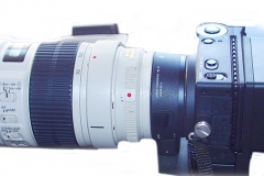 Sigma FP camera with the Sigma LVF-11 LCD Viewfinder for fp Mirrorless Digital Camera, and a Canon 70-200mm f2.8 L lens attached using the Mount converter MC-21