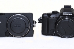 Sigma FP camera on the left next to a point and shoot camera. Almost the same size but no comparison