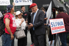 Curtis Sliwa, Republican Mayoral candidate for New York City, speaks with a woman outside the Manhattan office of New York Governor Andrew Cuomo in New York on 04 August 2021. Sliwa called for Governor Andrew Cuomo to step down amid the Attorney General's report backing up allegations that the Governor sexually harassed women.