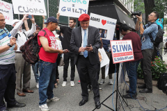 Curtis Sliwa, Republican Mayoral candidate for New York City, speaks with a woman outside the Manhattan office of New York Governor Andrew Cuomo in New York on 04 August 2021. Sliwa called for Governor Andrew Cuomo to step down amid the Attorney General's report backing up allegations that the Governor sexually harassed women.