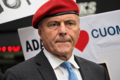 Curtis Sliwa, Republican Mayoral candidate for New York City, speaks with a woman outside the Manhattan office of New York Governor Andrew Cuomo in New York on 04 August 2021. Sliwa called for Governor Andrew Cuomo to step down amid the Attorney General's report backing up allegations that the Governor sexually harassed women.