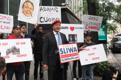 Curtis Sliwa, Republican Mayoral candidate for New York City, speaks with a woman outside the Manhattan office of New York Governor Andrew Cuomo in New York on 04 August 2021. Sliwa called for Governor Andrew Cuomo to step down amid the Attorney General's report backing up allegations that the Governor sexually harassed women.