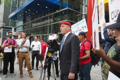 Curtis Sliwa, Republican Mayoral candidate for New York City, speaks with a woman outside the Manhattan office of New York Governor Andrew Cuomo in New York on 04 August 2021. Sliwa called for Governor Andrew Cuomo to step down amid the Attorney General's report backing up allegations that the Governor sexually harassed women.