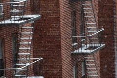 December 17,2020   Snow Storm hits New York City. Kids playing in the snow and adultsshoveling snow and cleaning off cars.