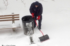 December 17,2020   Snow Storm hits New York City. Kids playing in the snow and adultsshoveling snow and cleaning off cars.