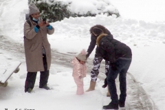 December 17,2020   Snow Storm hits New York City. Kids playing in the snow and adultsshoveling snow and cleaning off cars.