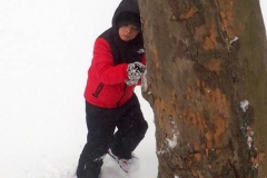 December 17,2020   Snow Storm hits New York City. Kids playing in the snow and adultsshoveling snow and cleaning off cars.