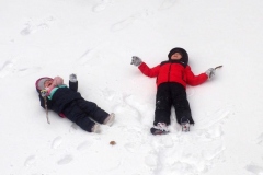 December 17,2020   Snow Storm hits New York City. Kids playing in the snow and adultsshoveling snow and cleaning off cars.