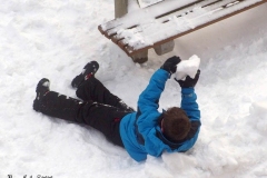 December 17,2020   Snow Storm hits New York City. Kids playing in the snow and adultsshoveling snow and cleaning off cars.